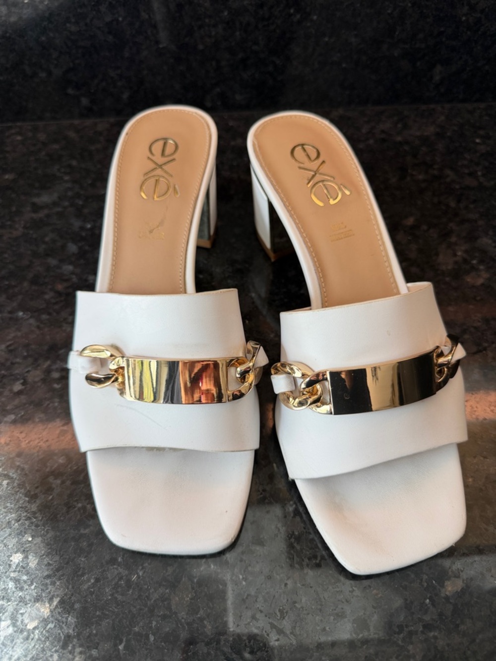 Exé White Leather Block Heel Mules with Gold Chain Accent